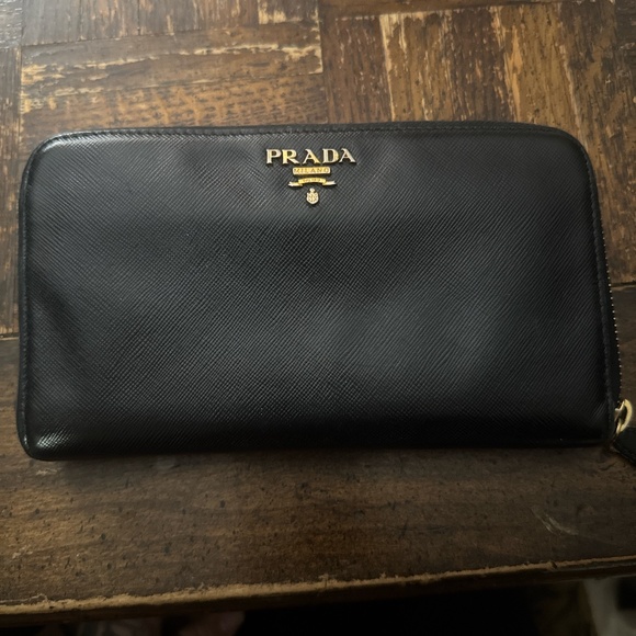 Prada Handbags - AUTHENTIC Prada long wallet black leather with COA.